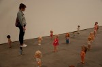 Lexi Lee wanders amongst the dolls.