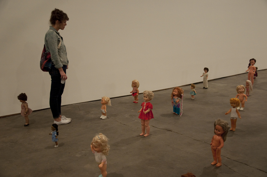 Lexi Lee wanders amongst the dolls.