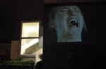 A video installation titled aEœHysteriaaE (1997), by Sam Taylor Wood, was projected onto the outside of the building, depicting a woman crying hysterically on loop.
