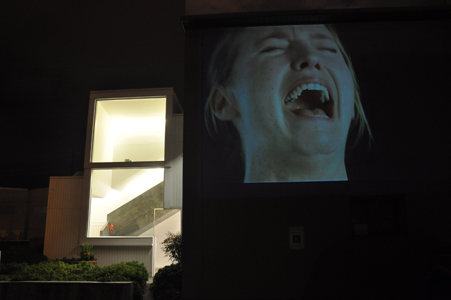 A video installation titled aEœHysteriaaE (1997), by Sam Taylor Wood, was projected onto the outside of the building, depicting a woman crying hysterically on loop.