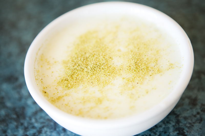 Ferni A light, silky pudding of milk and starched flavored with rosewater, cardamon, and pistachios.