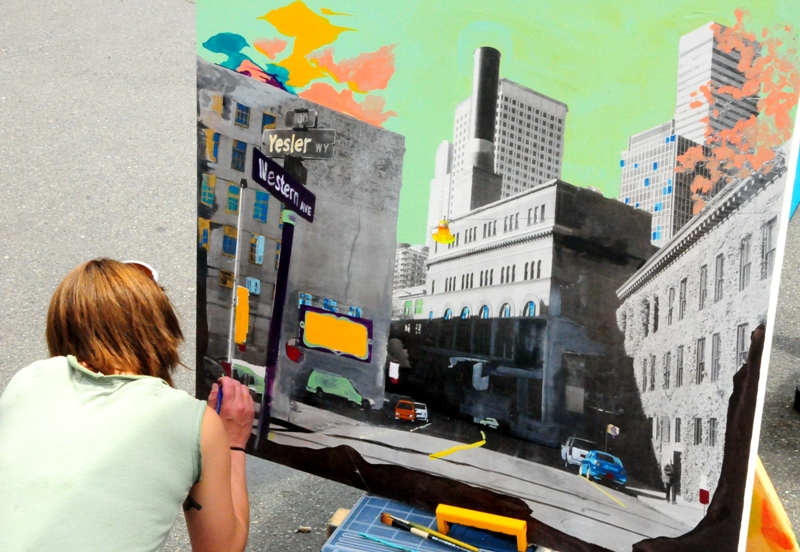Lily Cutler paints the scene at 619 Western.