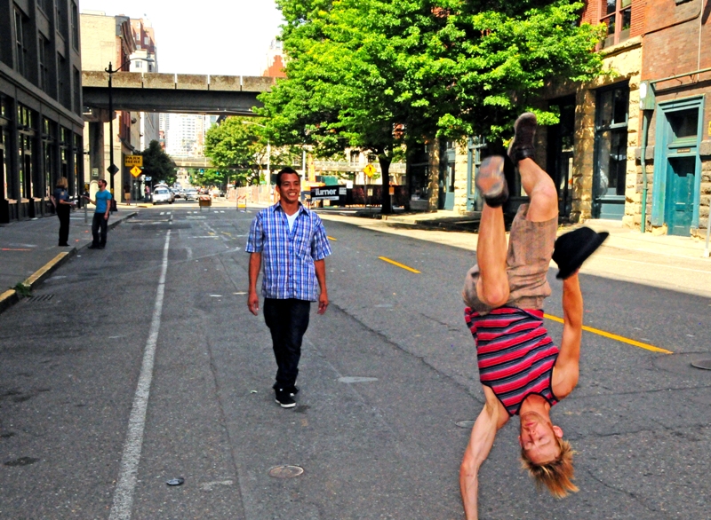 Choreographer Bobby Bonsey and Jonatan Ortiz practice  a hat move on the street in front of 619 Western.