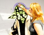 Hera creates a Yoda mural on the wall of 619 Western.