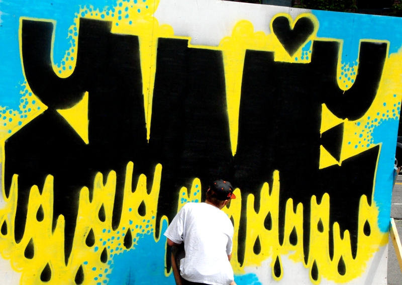 Alex begins work on his mural.
