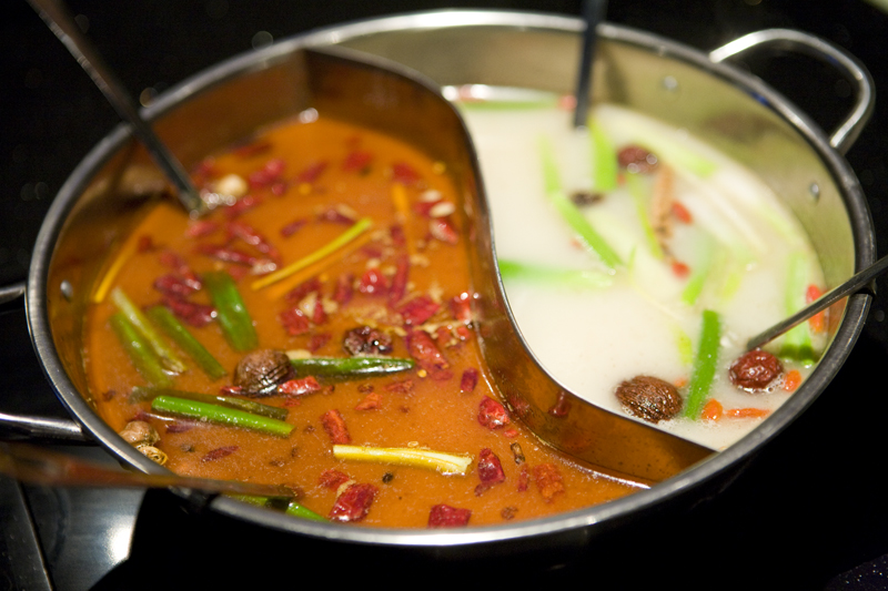 The split soup base. Original on the right and spicy on the left.