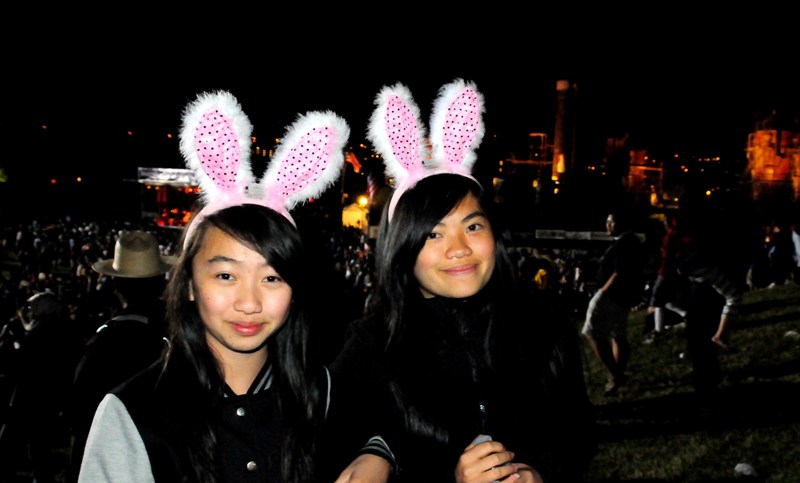 Thien Thea Bui and Kendra Nguyen wear red white and blue flashing rabbit ears.