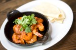 Chipotle Prawns: Half pound of wild prawns in a spicy garlic chipotle sauce. Served with rice and beans and house made tortillas.