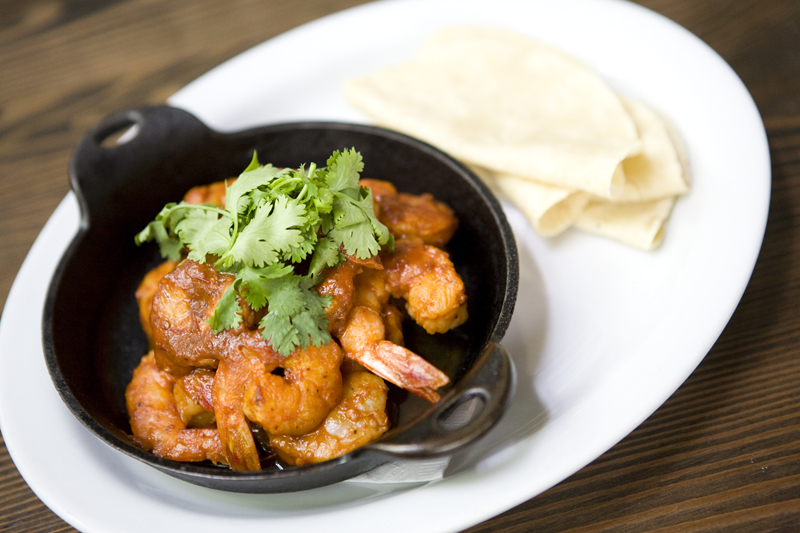 Chipotle Prawns: Half pound of wild prawns in a spicy garlic chipotle sauce. Served with rice and beans and house made tortillas.