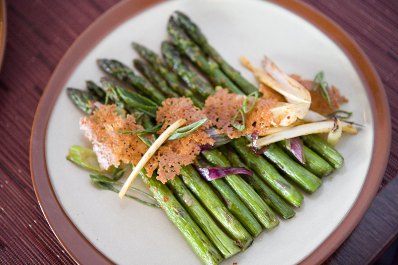 Roasted asparagus with spring onions and bonneted with toasted disc of haloumi cheese.