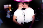 Richard Lynch and Zachary James, both from Federal Way, kiss on the dance floor.