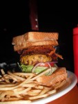 Source: PhoenixWhere: The LodgeWhat's better than a burger? Try a burger sandwiched between two grilled cheese...sandwiches! The Lodge in Scottsdale, Arizona has such a burger and they called it The Sasquatch. Eat this burger and you won't get a free T-shirt or your picture on some sort of wall of fame. No, you'll get the satisfaction that you are a man; a man who is very, very full. Read more on Phoenix New Times: Big Ass Burger Battle.