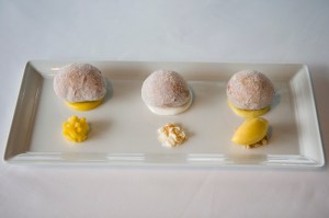 Malasadas: Warm Portugese doughnuts, with passion fruit-vanilla bean cream, coconut and macadamia nuts.
