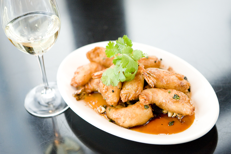 Princess Prawns Large prawns lightly battered and wok fried in a sweet and sour sauce with peanuts and chili at Wild Ginger.