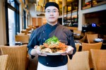 Executive Chef of Wild Ginger, Jacky Lo with the Singapore style Dungeness crab.