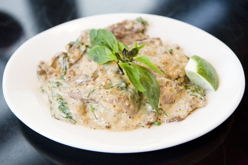 Panang Beef CurrySlices of marinated flank steak, served in a Thai curry of cardamom, coconut milk, Thai basil and fresh, pounded peanuts.