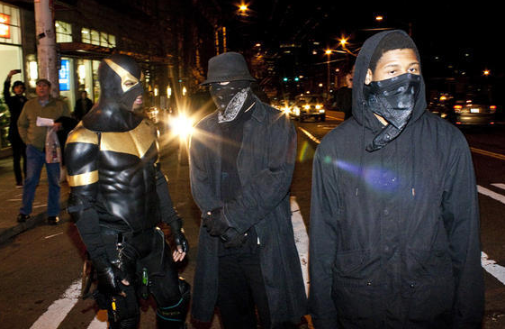 At a Police Brutality Riot protesting Ian Birk escaping charges, participants spit at and threatened Seattle Weekly's photographer, Joe Dyer.