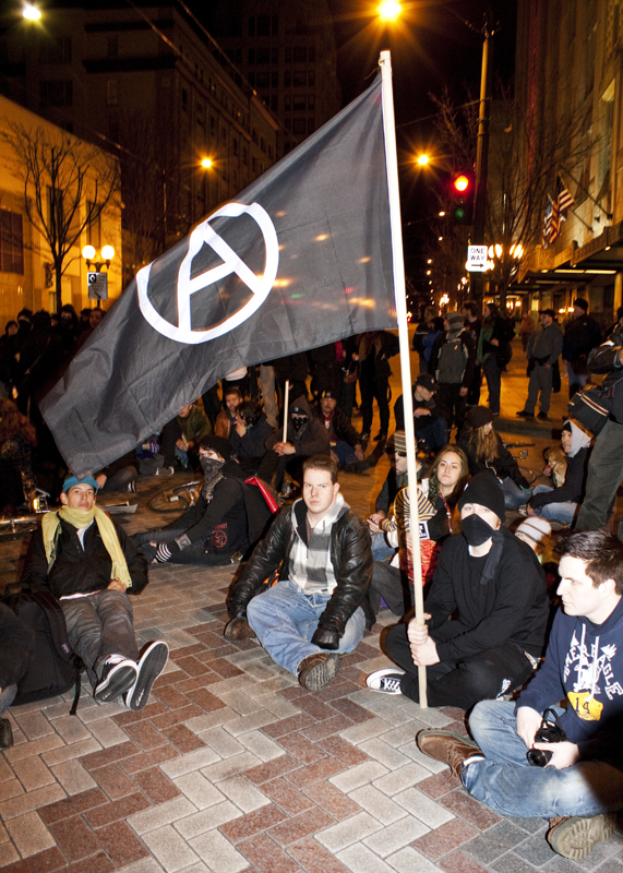 At 4th and Pine protesters gain control of the intersection, blocking traffic by laying down or sitting in the middle of the street.
