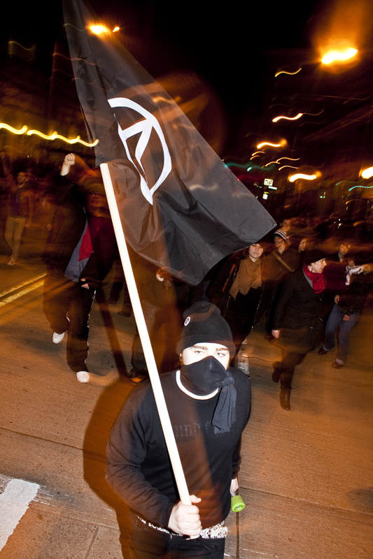 Anarchist at the front of the march.