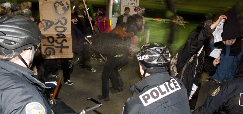 From where I was standing it was unclear what provoked officers to use the spray. This picture shows he first use of the spray on the protestors. My best guess was that several protestors tried to cross the makeshift police line in a way that made the officers feel threatened.