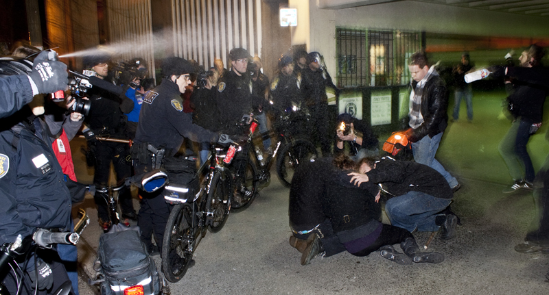 Several are down after being sprayed directly with pepper spray. When other protesters tried to come the aid of the fallen, officers sprayed them too.