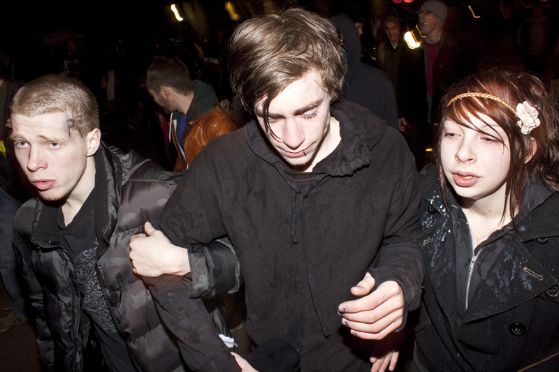 Friends help each other out of the area after taking a pretty hard hit from the spray.