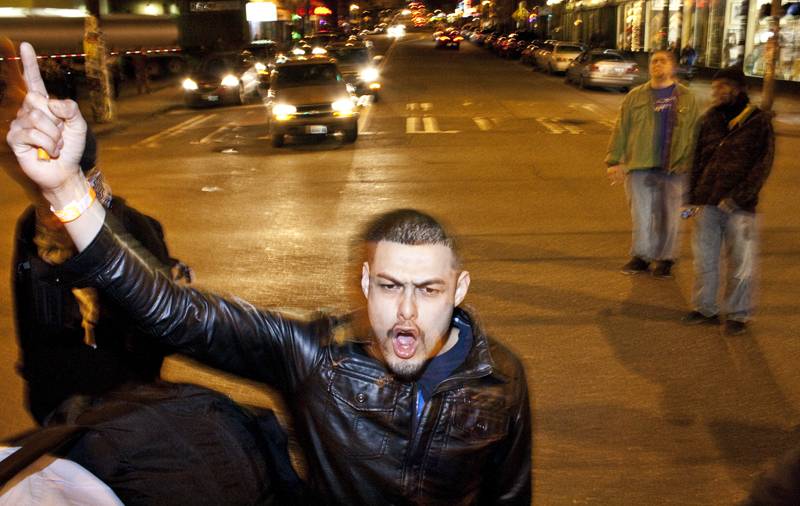 This man yells after the marchers manage to block this intersection on Capitol Hill.
