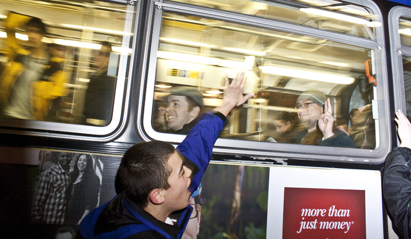 Protesters seek support from people on the busses.