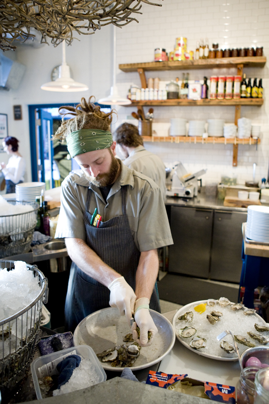 Cook Anthony Pane works on oysters.