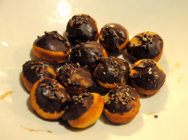 PikeaE™s wood aged stout brioche doughnuts dunked in Theo chocolate ganache.