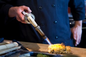 Chef Jose, torching the outside of the super bad boy roll.