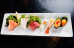 Omakase Sashimi Nigiri:IaE™m pretty sure the things on this dish are tuna, salmon, yellowtail, albacore, and shrimp.