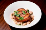 Lecosho Porchetta:Porchetta on white beans with pork jus.