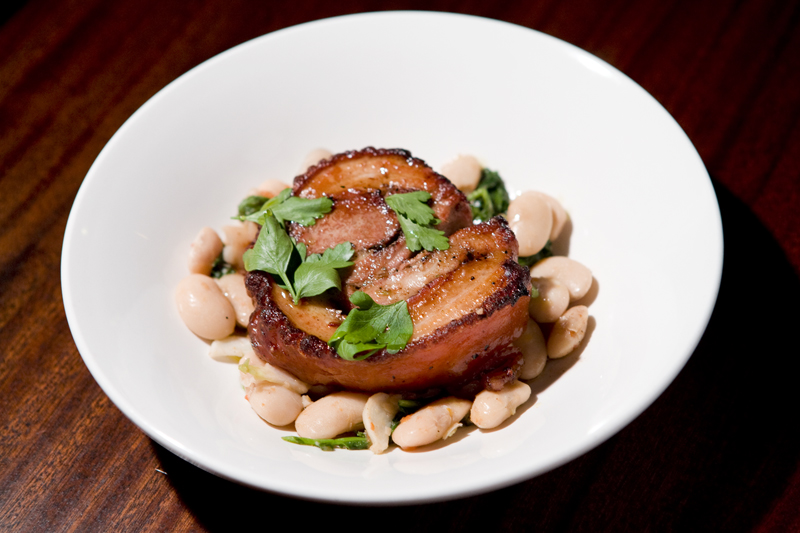 Lecosho Porchetta:Porchetta on white beans with pork jus.