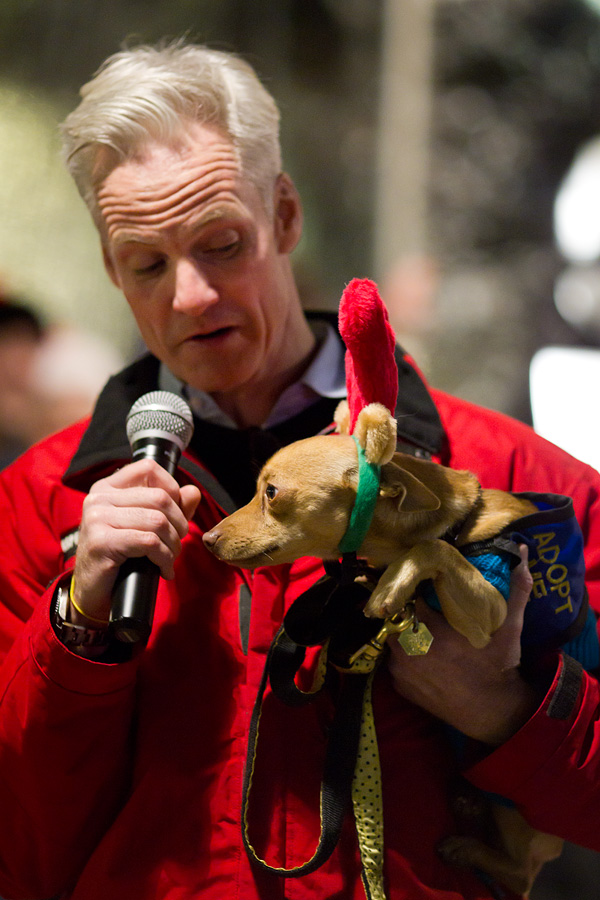 Among the puppies walking around the event, several were visiting from the Seattle Humane Society and were available for adoption. John Curley takes a moment to introduce one of these abandoned dogs here, Chester.