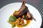 Curried lamb ribs with pickled green papaya and currant chutney.
