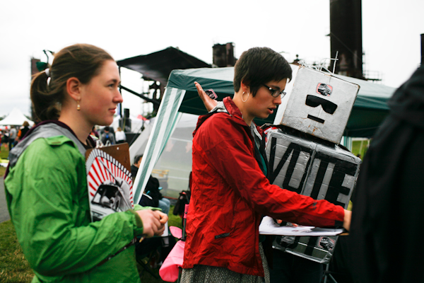 Two women and a person dressed as a robot register people to vote at Gasworks Park during the Family 4th Picnic in Seattle, Wash., on Sunday, July 4, 2010. (Photo by Matthew Williams for The Seattle Weekly)