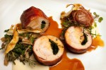Prosciutto-wrapped rabbit with salsify and maitake mushrooms.