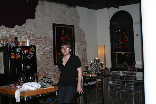 Musician Jonathan Warman hanging out in a neighbor's Yesler Street loft.