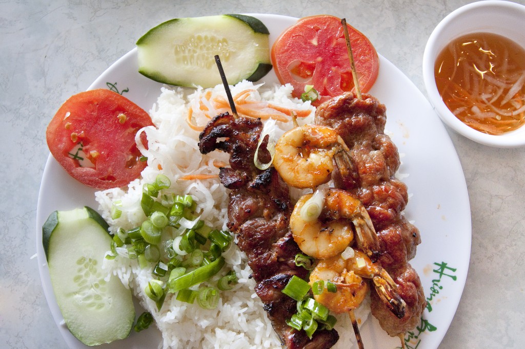 Rice plate with grilled pork, shrimp and pork meatballs.
