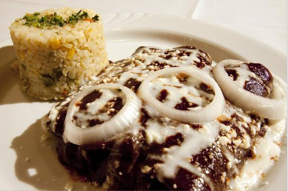 There's something weird, but good, going on with El Mestizo's mole - Jason Sheehan couldn't quite figure it out. But that's not a bad thing.