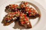 Molletes (vegetarian). Toasted bread with beans, queso, and pico de gallo.