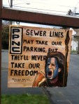 16. PARKING ON LAURA ONSTOT'S STREET HAS BEEN SEVERELY IMPACTED BY NEARBY CONSTRUCTION  Did you know that a developer can block off all the parking in your neighborhood because he's building a pair of houses a mile away? Well, it's true. To wit: A company we'll call Riser Homes is extending sewer lines to property it's developing in West Seattle, and has dug a hole in the street. So Metro buses bound for South Seattle Community College have been rerouted to an adjacent block, a block on which a Seattle Weekly writer happens to live. And because apparently a Metro bus needs a very wide berth, in mid-February signs went up all along both sides of this already-relatively-wide-for-Seattle street, declaring No ParkingaE”for two months! Bear in mind that this is Pigeon Point, an island of a neighborhood bordered by cliffs, green belts, and the West Seattle Bridge. Finding street parking has always been a challenge, and now it's nearly impossible. Not to mention that at regular intervals the 125 comes barreling through an area where kids are often riding tricycles or playing catch with a dog in the front yard. One artistically gifted neighbor painted Scottish freedom fighter William Wallace's likeness on a signboard declaring: Sewer lines may take our parking, but they'll never take our freedom! Except that's exactly what they did.