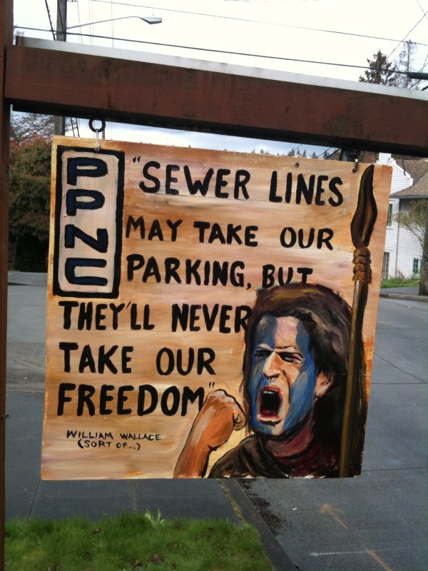 16. PARKING ON LAURA ONSTOT'S STREET HAS BEEN SEVERELY IMPACTED BY NEARBY CONSTRUCTION  Did you know that a developer can block off all the parking in your neighborhood because he's building a pair of houses a mile away? Well, it's true. To wit: A company we'll call Riser Homes is extending sewer lines to property it's developing in West Seattle, and has dug a hole in the street. So Metro buses bound for South Seattle Community College have been rerouted to an adjacent block, a block on which a Seattle Weekly writer happens to live. And because apparently a Metro bus needs a very wide berth, in mid-February signs went up all along both sides of this already-relatively-wide-for-Seattle street, declaring No ParkingaE”for two months! Bear in mind that this is Pigeon Point, an island of a neighborhood bordered by cliffs, green belts, and the West Seattle Bridge. Finding street parking has always been a challenge, and now it's nearly impossible. Not to mention that at regular intervals the 125 comes barreling through an area where kids are often riding tricycles or playing catch with a dog in the front yard. One artistically gifted neighbor painted Scottish freedom fighter William Wallace's likeness on a signboard declaring: Sewer lines may take our parking, but they'll never take our freedom! Except that's exactly what they did.