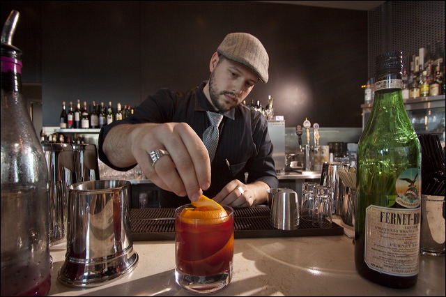 Bartender Andrew Bohrer mixing the Bitter Handshake.