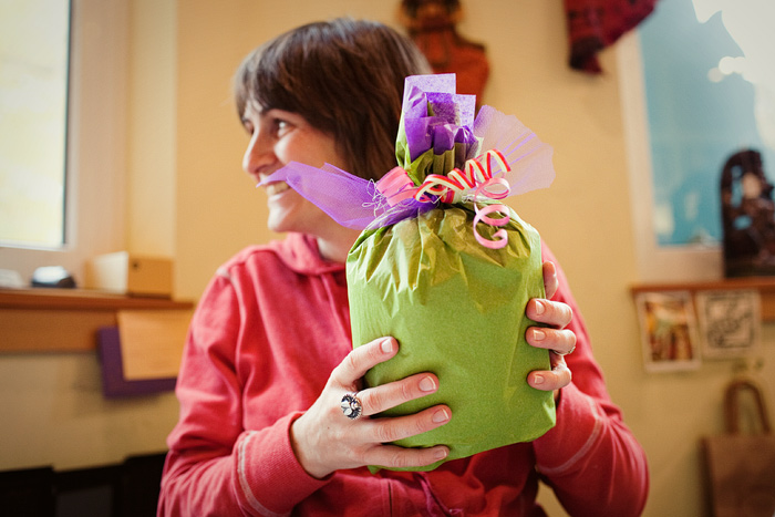 Amy at Jaywalk gift wraps a baby blanket by Annie Erickson for one of her customers.  Jaywalk carries 40 local artists and craftspeople's work in addition to Polish pottery, antiques and other treasures.