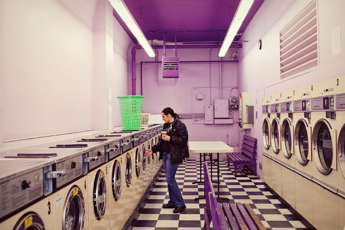 Toni prefers the Madrona Laundromat to others in the area because it's always clean and the people are nice. I like it because it's purple and has a checkered floor.