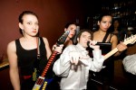 Robert Palmer by the bar with hisA Irresistible Girls