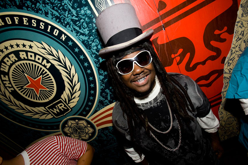 T-Pain poses next to Andre The Giant.