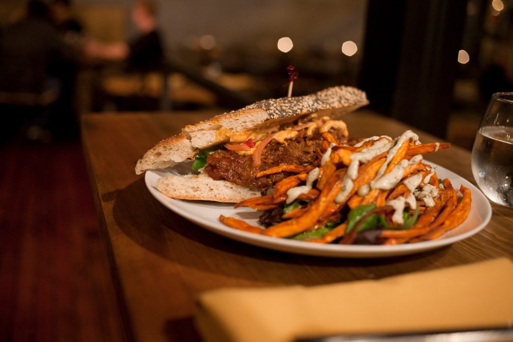 PlumaE™s BBQ poaE™ boy seems cleaner and less messy than the version at Hillside Quickies; lightly pressed between halves of a seeded baguette are fat chunks of seitan that have soaked up a half-pint or so of tangy-sweet barbecue sauce, with a smattering of Hello Kitty pink pickled red onions on top.